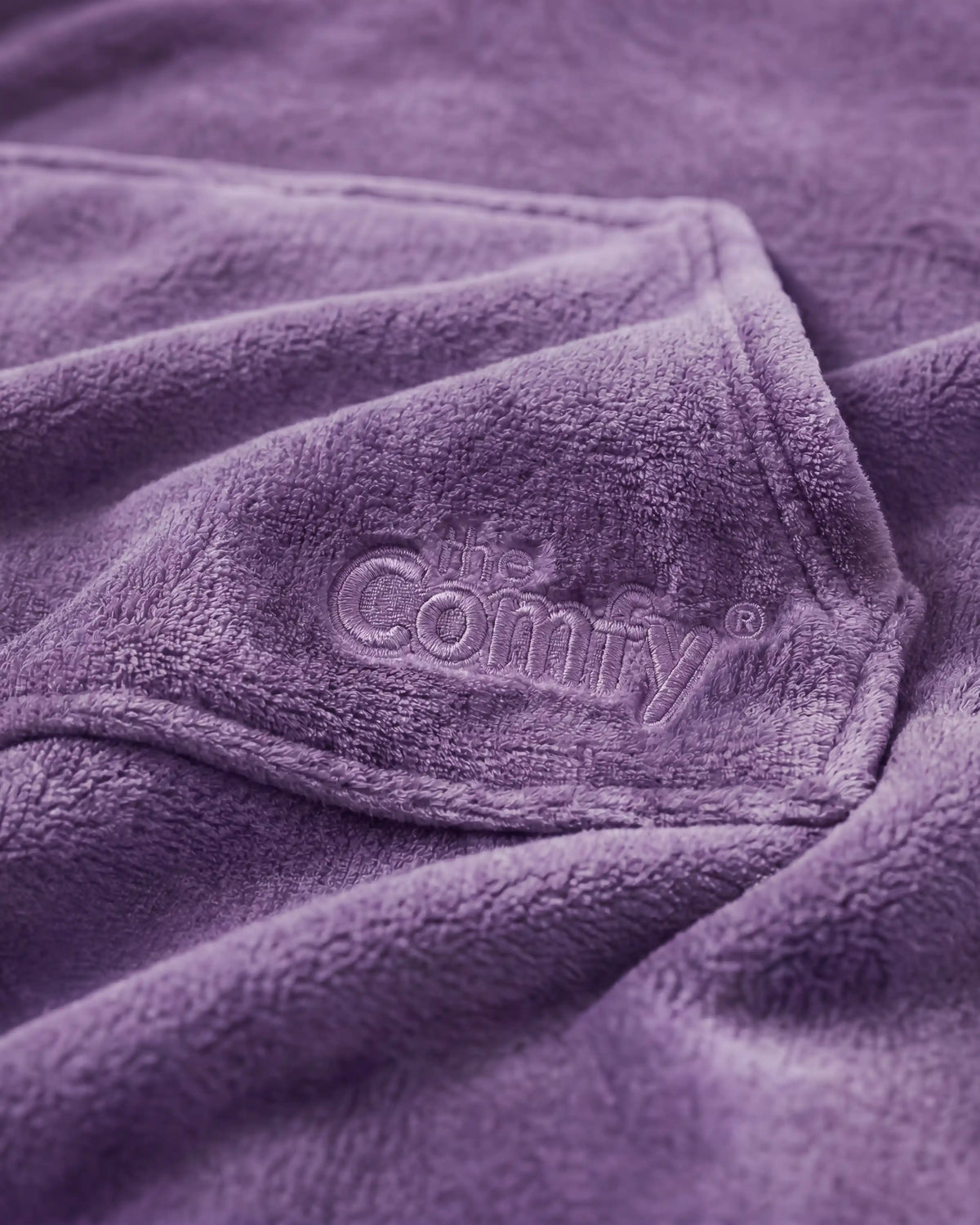 A close view of purple Dream fabric and tonal Comfy embroidery.