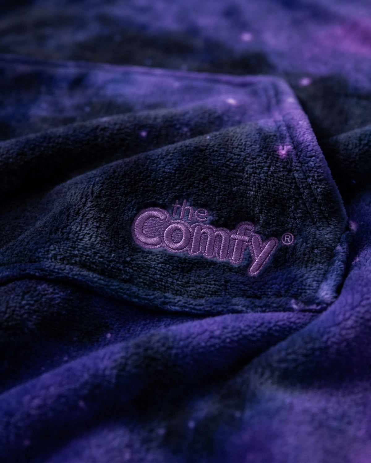 Close-up of The Dream in Galaxy showing DreamHaven™ fabric, the kangaroo pocket, and Comfy embroidery.