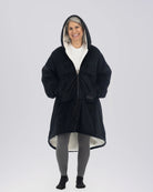 Model wearing The Original Full-Zip in Black, full-length hero view.