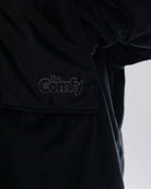 Close-up of The Original Full-Zip in Black showing its fabric and embroidered logo.