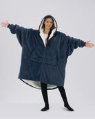 Model wearing The Original Full-Zip in Blue with arms extended to show the oversized fit.