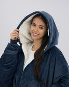 Model wearing The Original Full-Zip in Blue with the hood up.