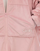 Close-up of The Original Full-Zip in Blush showing its fabric and embroidered logo.