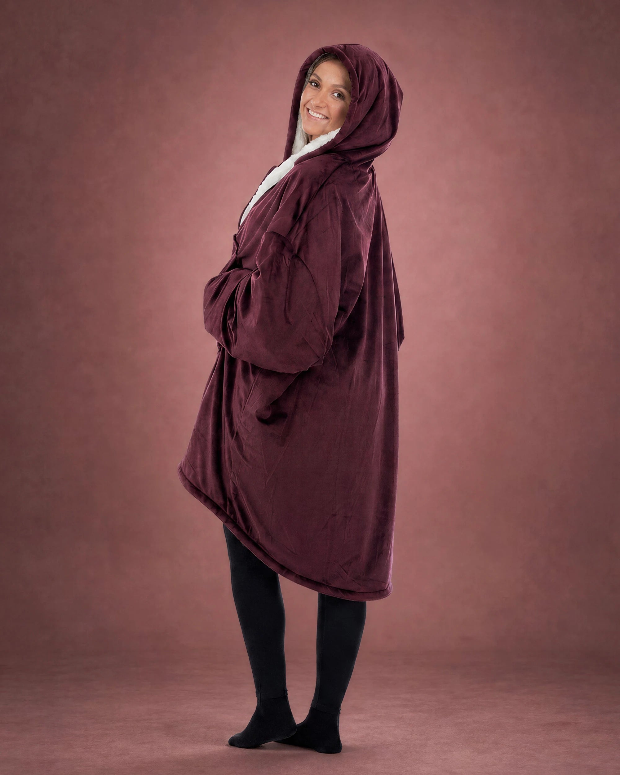 Side view of The Original Full-Zip wearable blanket in Burgundy highlighting hood, longer coverage, and relaxed silhouette.
