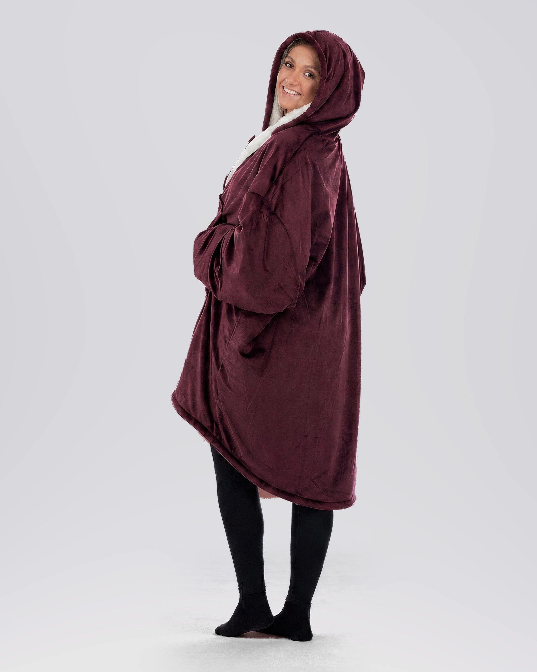 Side view of The Original Full-Zip wearable blanket in Burgundy highlighting hood, longer coverage, and relaxed silhouette.