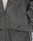 Close-up of The Original Full-Zip wearable blanket in charcoal showing zipper detail, Velveluxe™ exterior, and embroidered logo