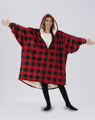 Model wearing The Original Full-Zip in Red Plaid with arms extended to show the oversized fit.
