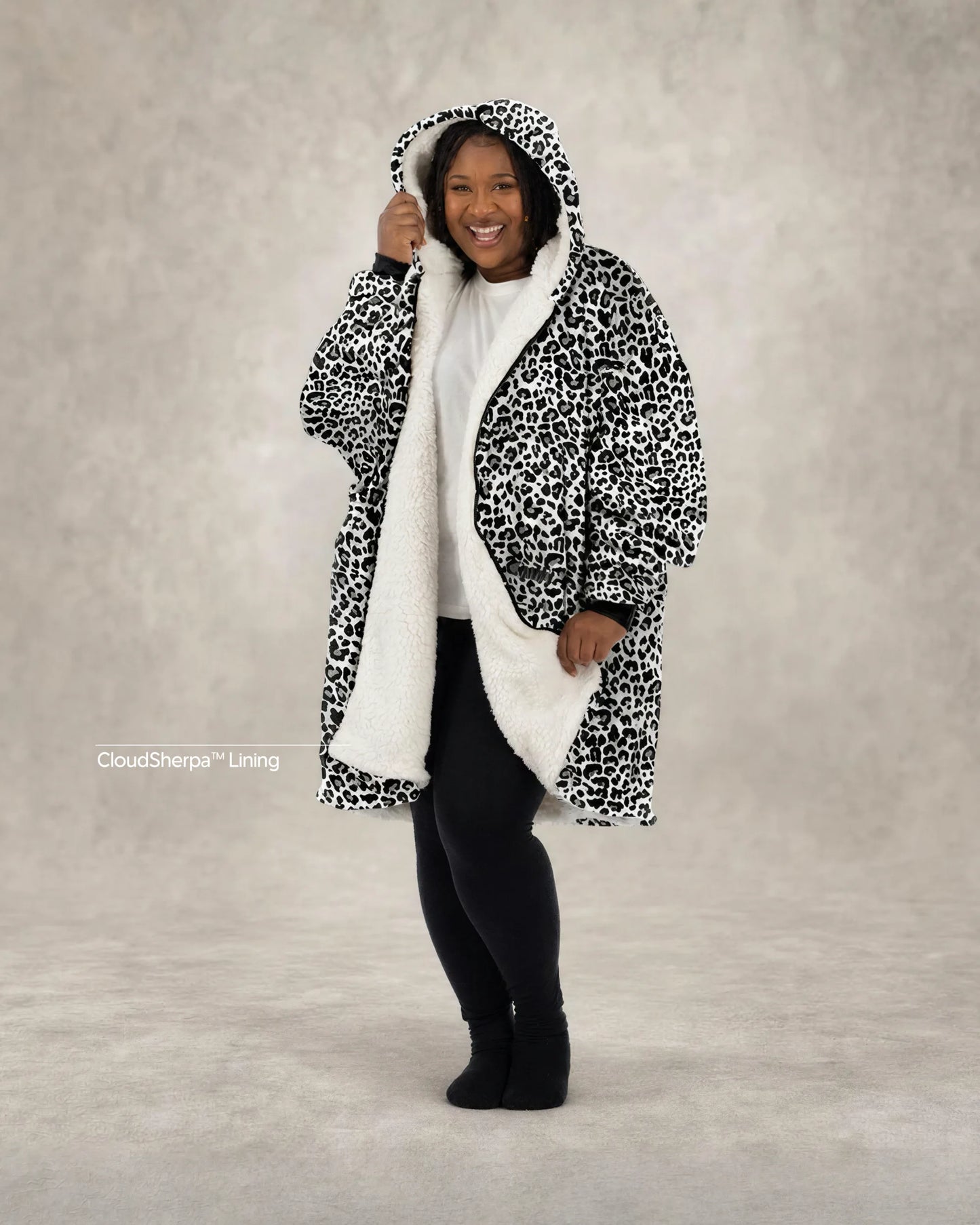 Model wearing The Original Full-Zip in Snow Leopard, showcasing the bold animal-inspired print, full-length zipper, and signature CloudSherpa™ lining for head-to-toe comfort.