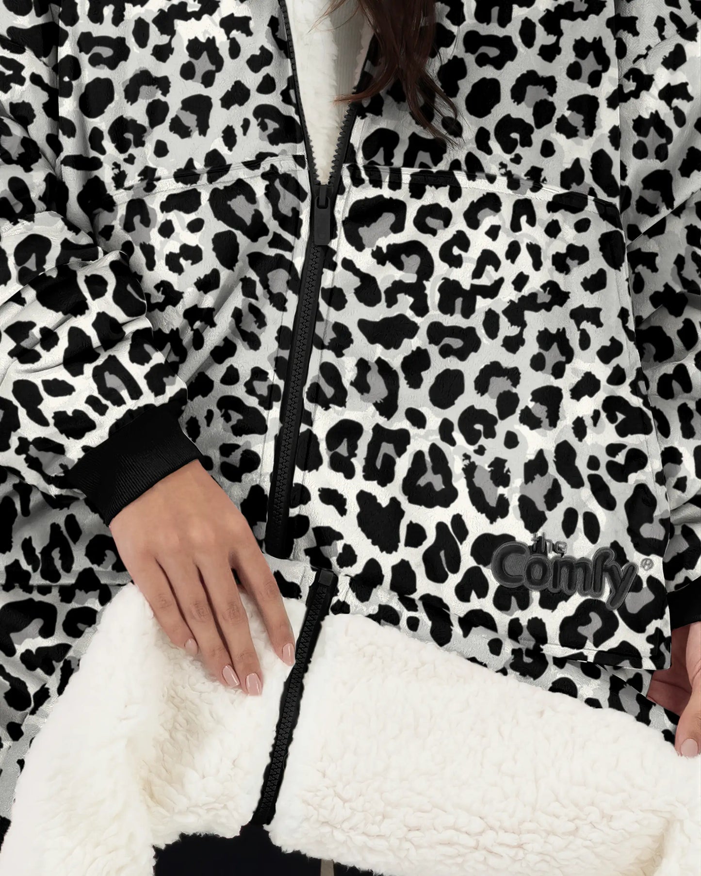 Close-up detail of The Original Full-Zip in Snow Leopard featuring the full-length zipper, kangaroo pocket, Velveluxe™ exterior, embroidered logo, and ultra-soft CloudSherpa™ lining.