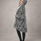 Side profile of a model wearing The Original Full-Zip in Snow Leopard, showcasing the relaxed oversized fit, full-zip construction, and cozy CloudSherpa™ interior.