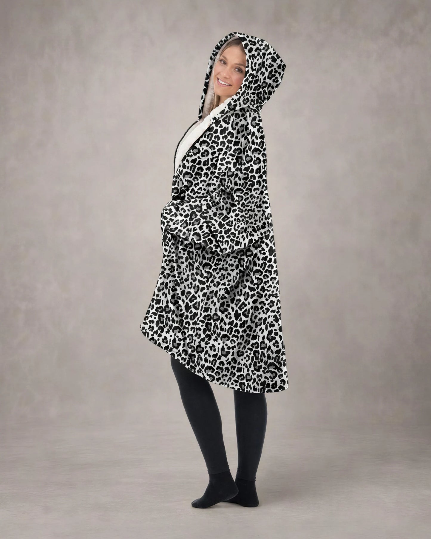 Side profile of a model wearing The Original Full-Zip in Snow Leopard, showcasing the relaxed oversized fit, full-zip construction, and cozy CloudSherpa™ interior.