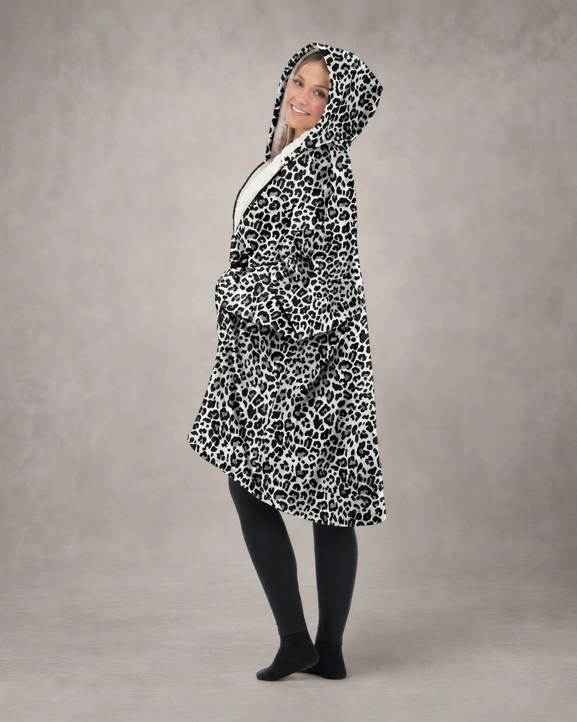 Side profile of a model wearing The Original Full-Zip in Snow Leopard, showcasing the relaxed oversized fit, full-zip construction, and cozy CloudSherpa™ interior.
