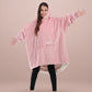 Child wearing The Original Jr. Blush wearable blanket with arms outstretched, showcasing roomy coverage and cozy comfort.