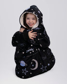 The Original Jr wearable blanket in Constellations, sitting view.