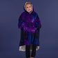 Child standing comfortably in The Original Jr. Galaxy wearable blanket, featuring full-body warmth and the roomy oversized silhouette.