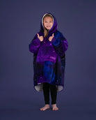 Child giving a thumbs up while wearing The Original Jr. Galaxy wearable blanket, showcasing all-day comfort and cozy coverage.