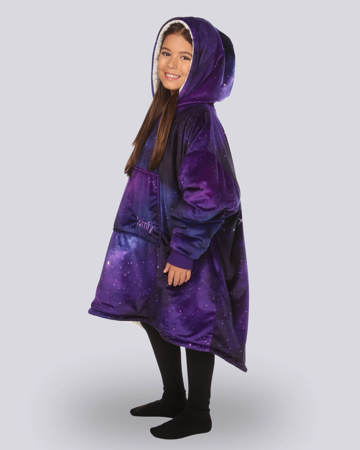 Child wearing The Original Jr. Galaxy wearable blanket showing the side view of the oversized blanket hoodie.