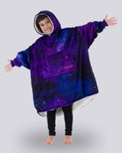 Child wearing The Original Jr. Galaxy wearable blanket with arms outstretched, showcasing the oversized fit, celestial-inspired print, and CloudSherpa™ lining.