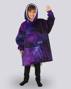 Child wearing The Original Jr. Galaxy wearable blanket in a waving pose, highlighting the oversized hood, kangaroo pocket, and cozy comfort.