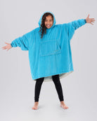 The Original Jr wearable blanket in NeonAqua, armsout view.