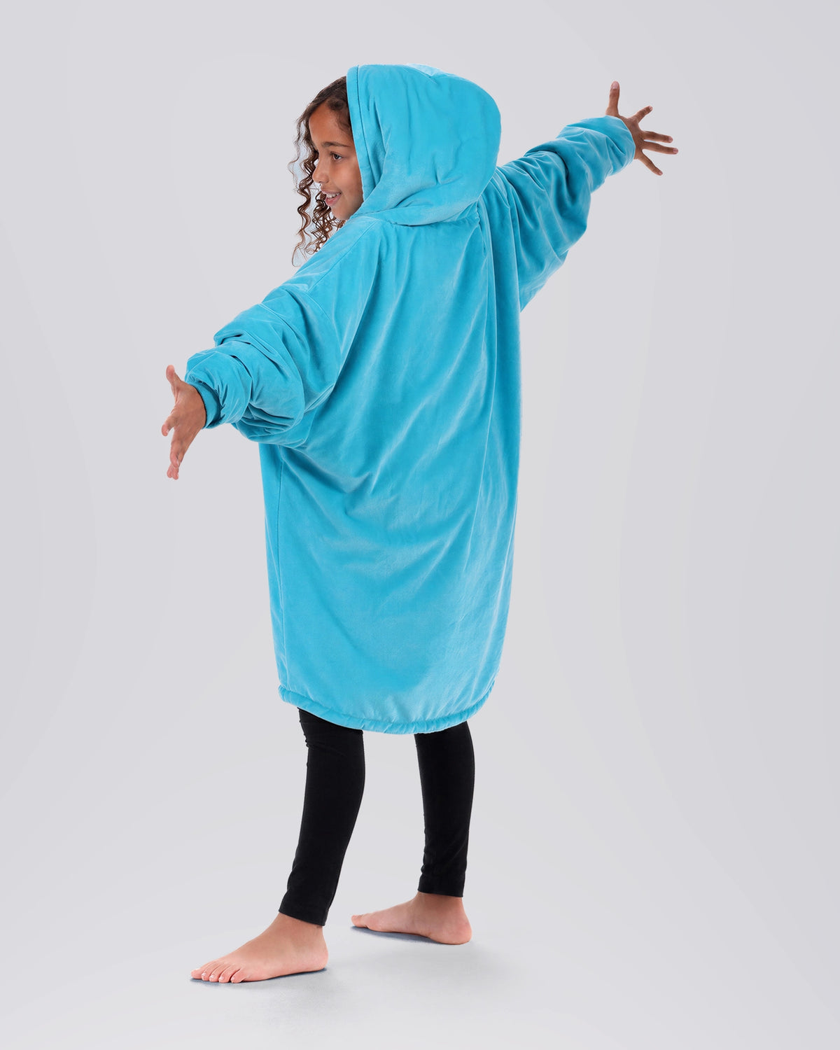 The Original Jr wearable blanket in NeonAqua, back view.