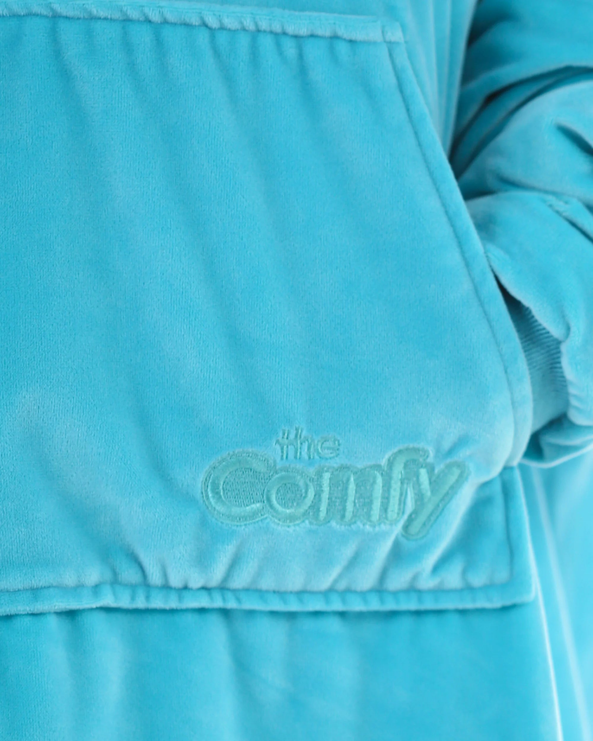 Close-up of The Original Jr. Neon Aqua wearable blanket, featuring the ultra-soft fabric texture and embroidered logo detail.