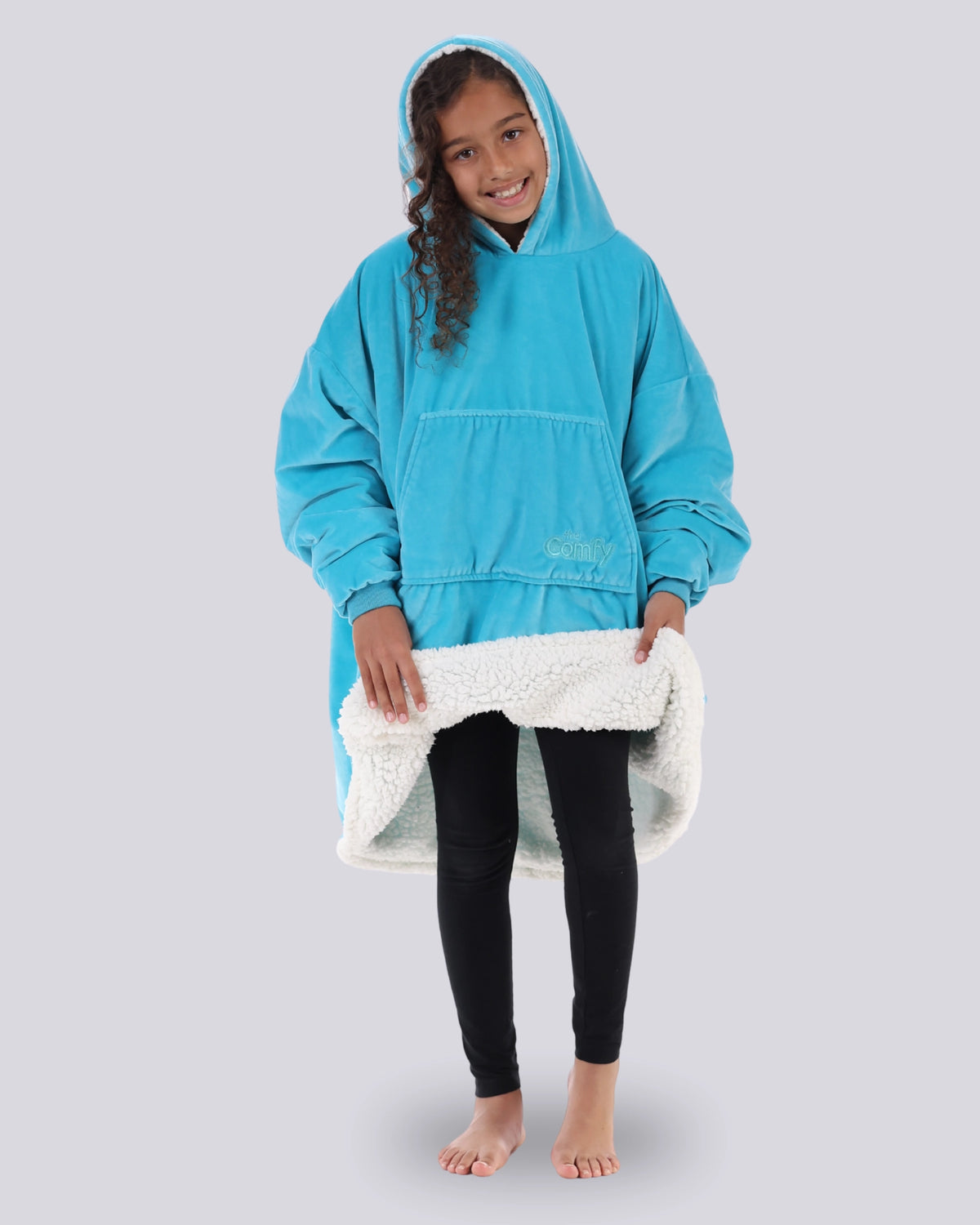 The Original Jr wearable blanket in Neon Aqua showing the inside sherpa lining.