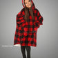 Child wearing The Original Jr. Red Plaid wearable blanket with CloudSherpa™ lining, featuring the classic buffalo plaid pattern, oversized hood, and cozy all-day comfort.