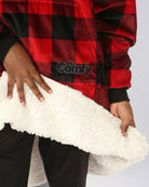 Close-up of The Original Jr. Red Plaid wearable blanket, showcasing the ultra-soft CloudSherpa™ lining and premium comfort-focused construction.