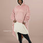 Woman wearing The Comfy Original Long in blush with CloudSherpa™ lining, front view showing oversized fit and sherpa interior.
