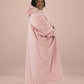 Side profile of woman wearing The Comfy Original Long in blush, showing full ankle-length silhouette and oversized drape.