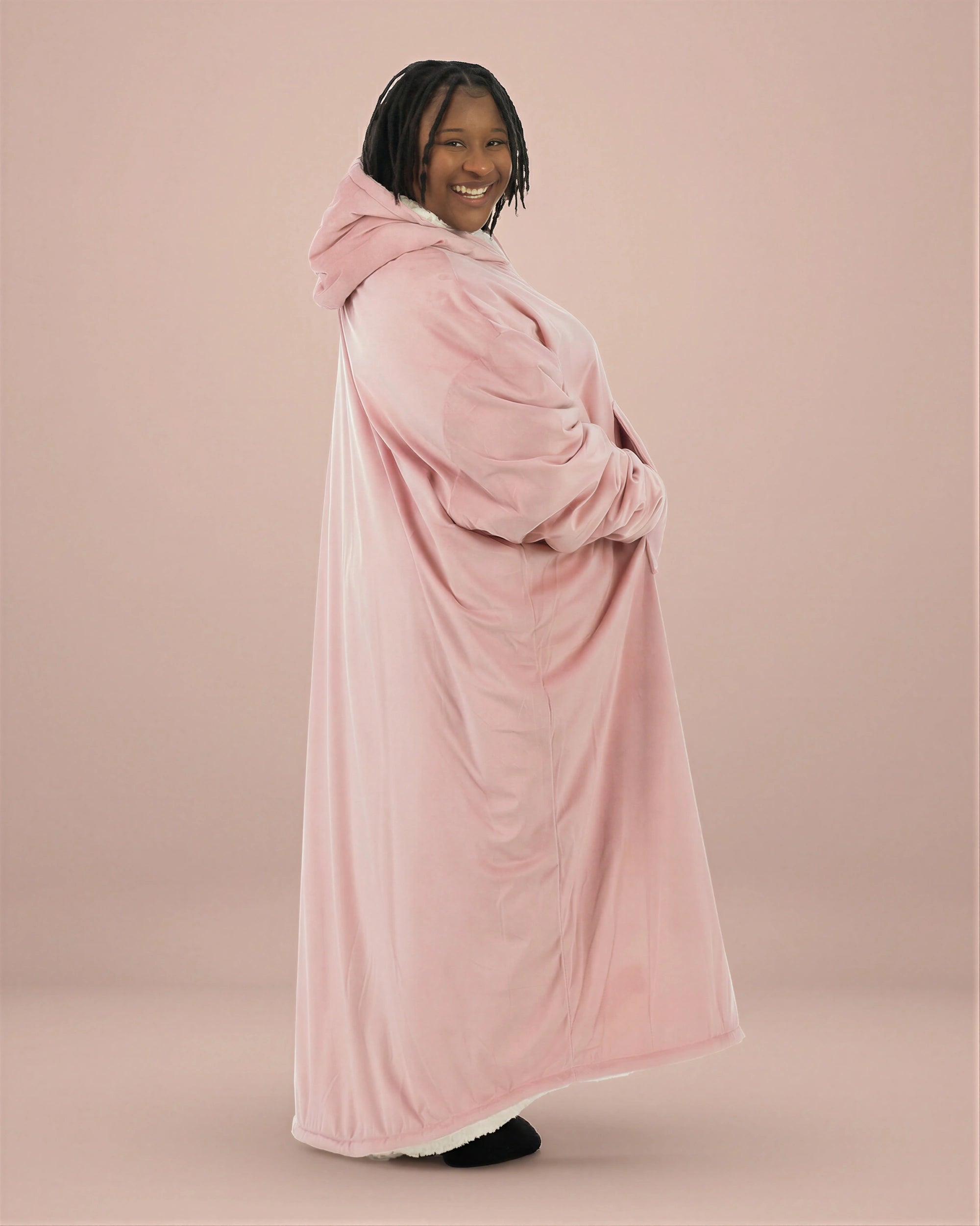 Side profile of woman wearing The Comfy Original Long in blush, showing full ankle-length silhouette and oversized drape.