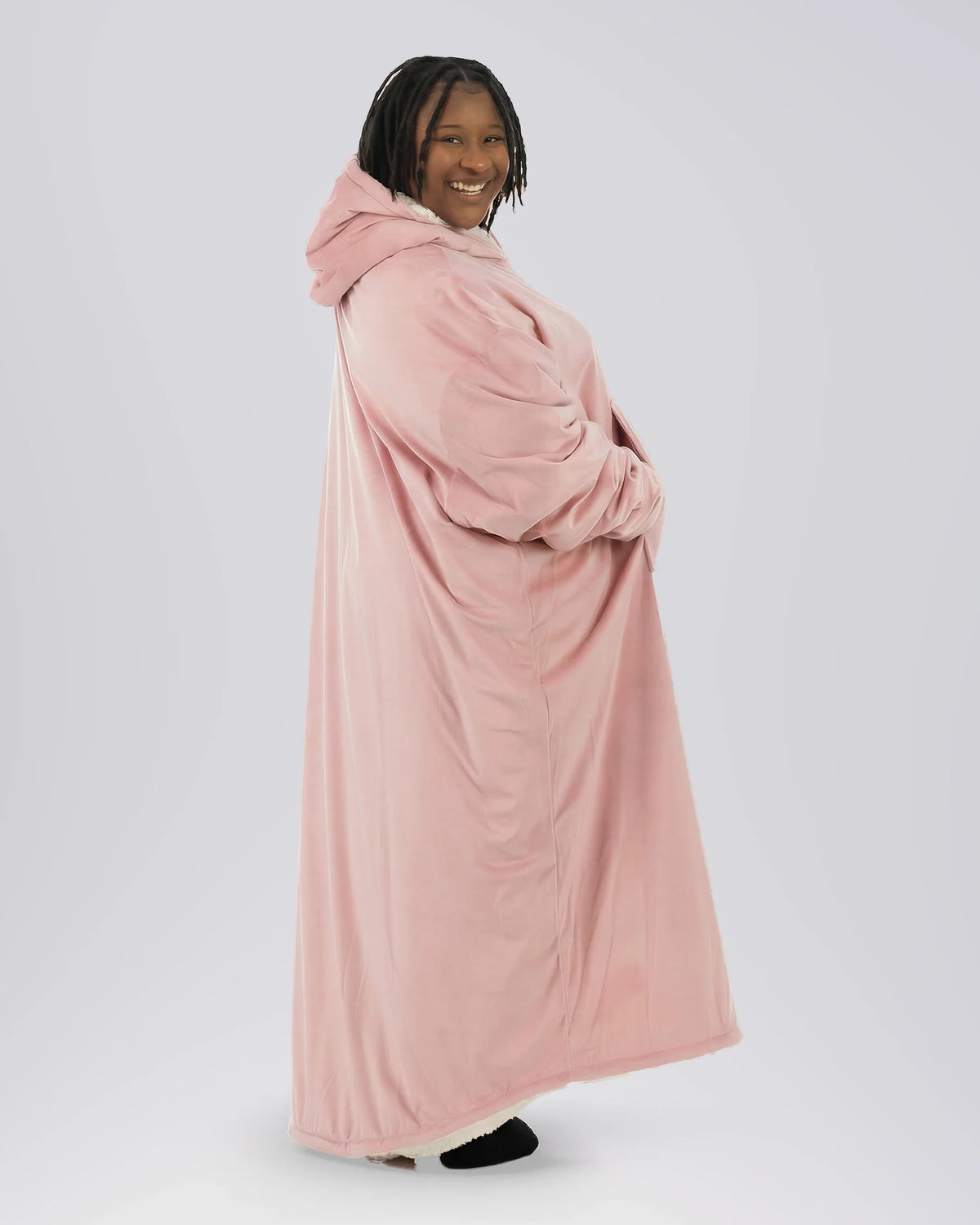 Side profile of woman wearing The Comfy Original Long in blush, showing full ankle-length silhouette and oversized drape.