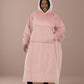 Woman wearing The Comfy Original Long in blush, casual front view with hood up and hand in kangaroo pocket.