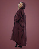 Side and back view of woman wearing The Comfy Original Long in burgundy, showing full length and hooded silhouette.
