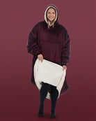 Front view of woman wearing The Comfy Original Long in burgundy, lifting hem to reveal CloudSherpa™ lining.