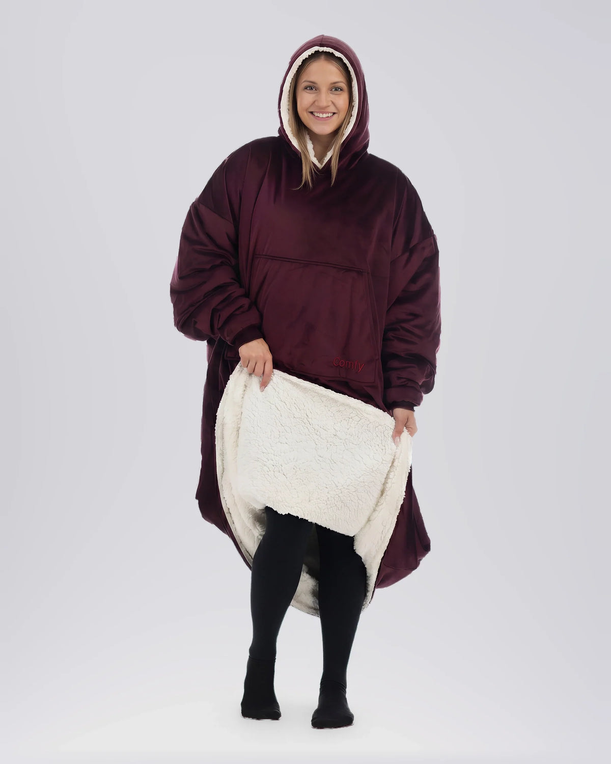 Front view of woman wearing The Comfy Original Long in burgundy, lifting hem to reveal CloudSherpa™ lining.