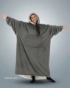 Woman wearing The Comfy Original Long in charcoal with CloudSherpa™ lining, front view showing oversized silhouette.