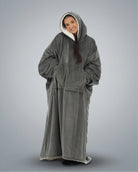 Woman wearing The Comfy Original Long in charcoal in a relaxed standing pose with hood up.
