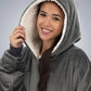 Close-up of woman wearing The Comfy Original Long in charcoal, highlighting hood and CloudSherpa™ lining.