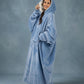 Side view of The Original Long in Serenity Blue featuring the ultra-soft Velveluxe™ exterior and cozy CloudSherpa™ lining, designed for extra warmth and relaxation.
