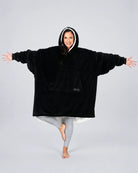 The Original wearable blanket in Black, shown full length with its oversized fit and plush CloudSherpa™ lining.
