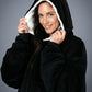 Close-up view of The Original wearable blanket in black showing hood with soft CloudSherpa™ lining