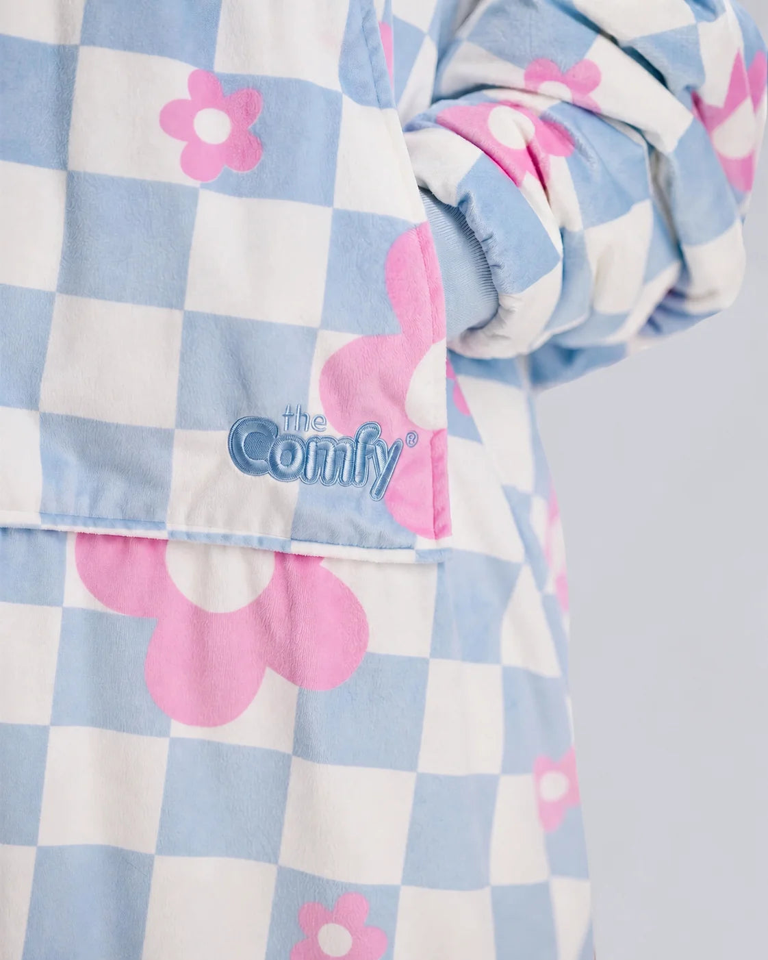 Close-up detail of The Original in Flower Checkered showcasing the premium printed Velveluxe™ fabric, embroidered logo, oversized pocket construction, and soft ribbed cuff.