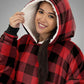 Close-up view of The Original wearable blanket in red plaid showing hood with soft CloudSherpa™ lining