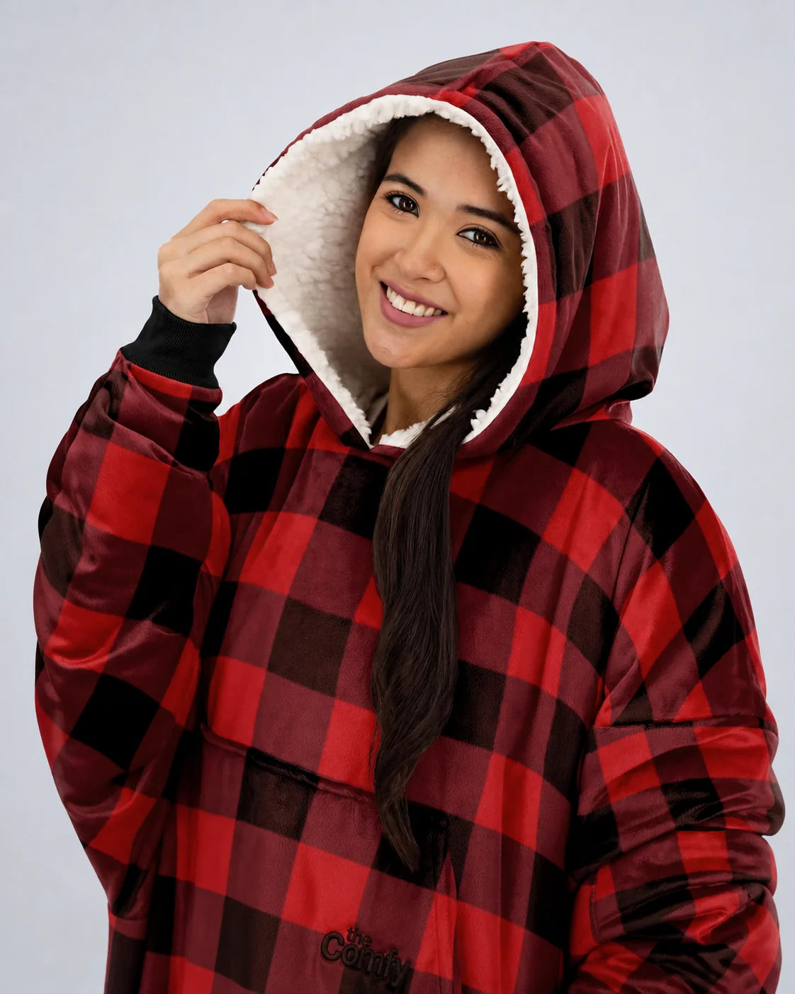 Close-up view of The Original wearable blanket in red plaid showing hood with soft CloudSherpa™ lining