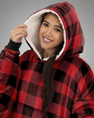 Close-up view of The Original wearable blanket in red plaid showing hood with soft CloudSherpa™ lining