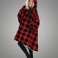 Front /side view of The Original wearable blanket in red plaid showing relaxed oversized comfort and coverage