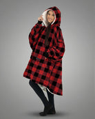 Front /side view of The Original wearable blanket in red plaid showing relaxed oversized comfort and coverage