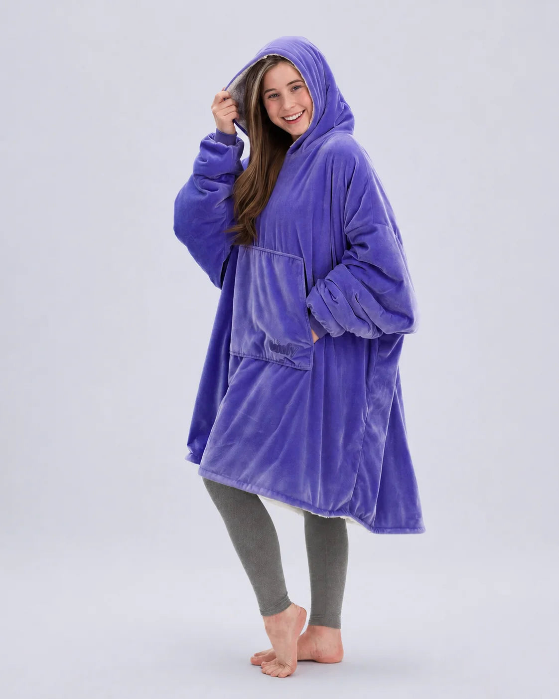 Side-angle view of The Original in Very Perri Purple, highlighting the relaxed oversized fit, roomy hood, and Velveluxe™ exterior designed for cozy comfort at home and beyond.